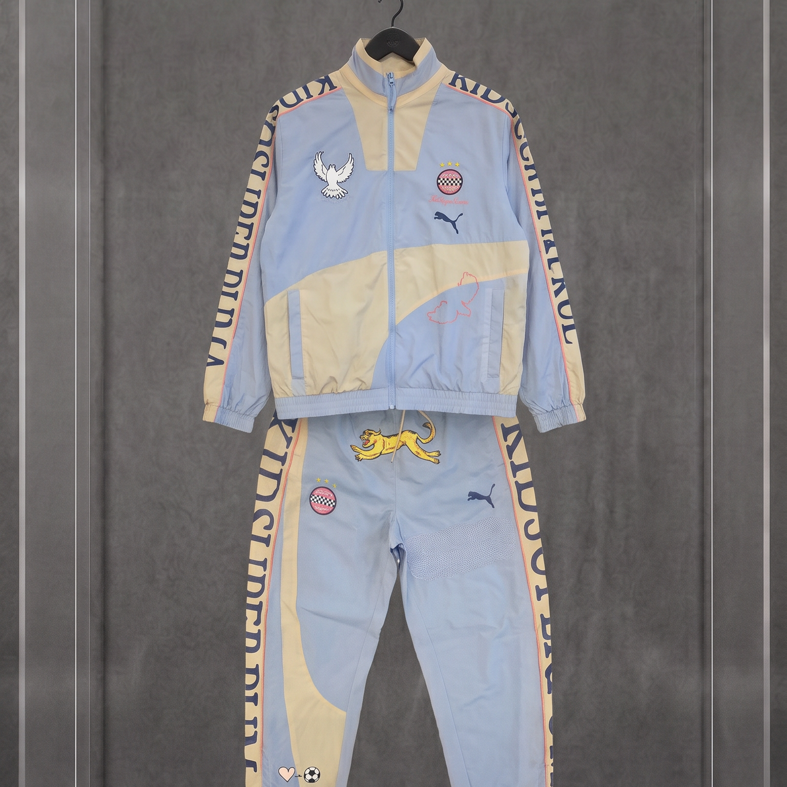 PUMA × KIDSUPER STUDIOS Conjunto Track (jaqueta + calça)